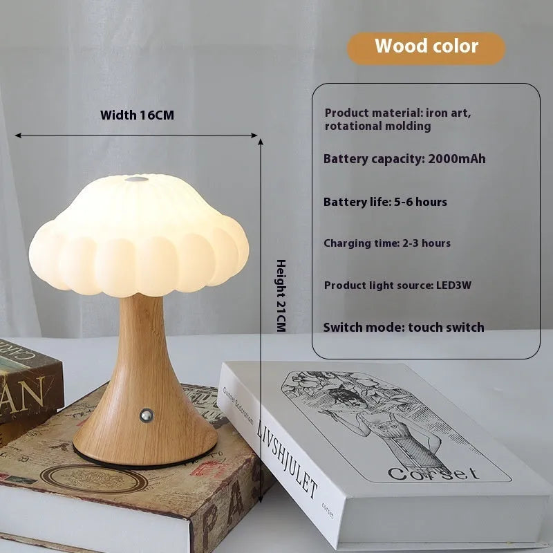 Small touch control rechargeable mushroom night light in wood grain colour on a table.