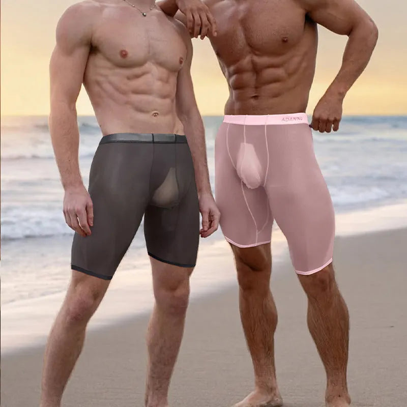 Men's solid colour seamless nylon lounge shorts in black, shown on a model.