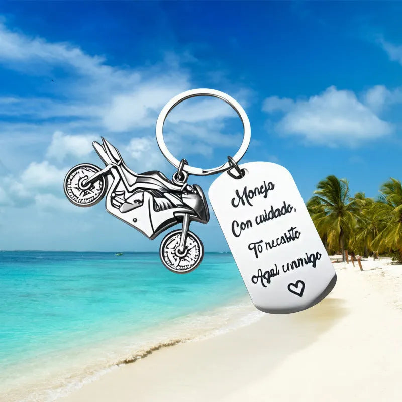 Stainless steel motorcycle keychain with a modern minimalist design, shown with a velvet flannel bag.