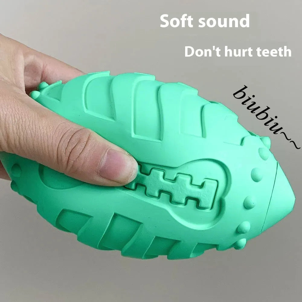Light green bite-resistant rubber rugby ball dog toy for chewing and interactive training.