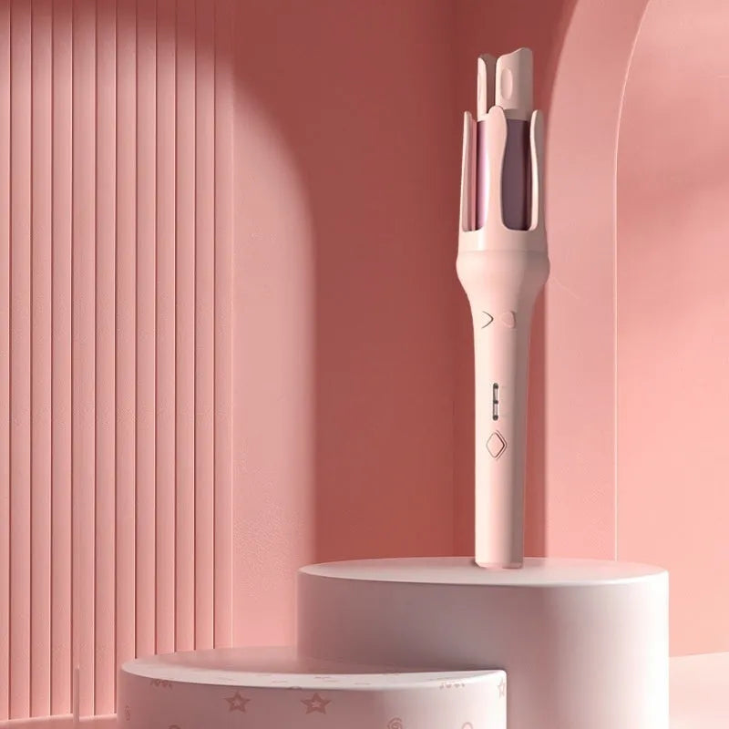 Automatic hair curler with 32mm ceramic barrel in pink, showing wired power cord and included US/EU travel adapters.