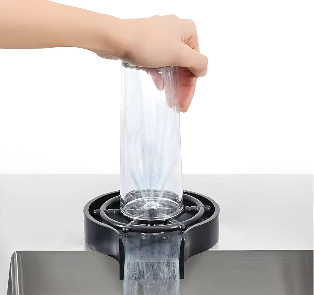 Black automatic stainless steel glass washer with ABS base and copper hose on a countertop.