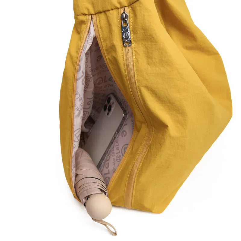 Heart-shaped soft nylon crossbody bag for women in black, blue, khaki, or yellow.