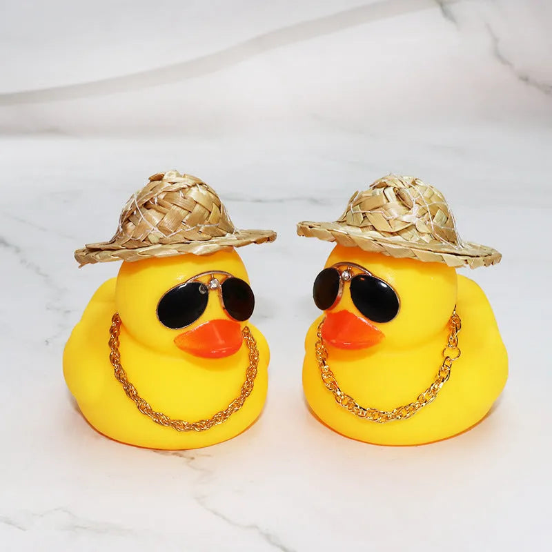 Yellow duck cartoon character wearing straw hat car dashboard ornament with sunglasses and necklace accessories