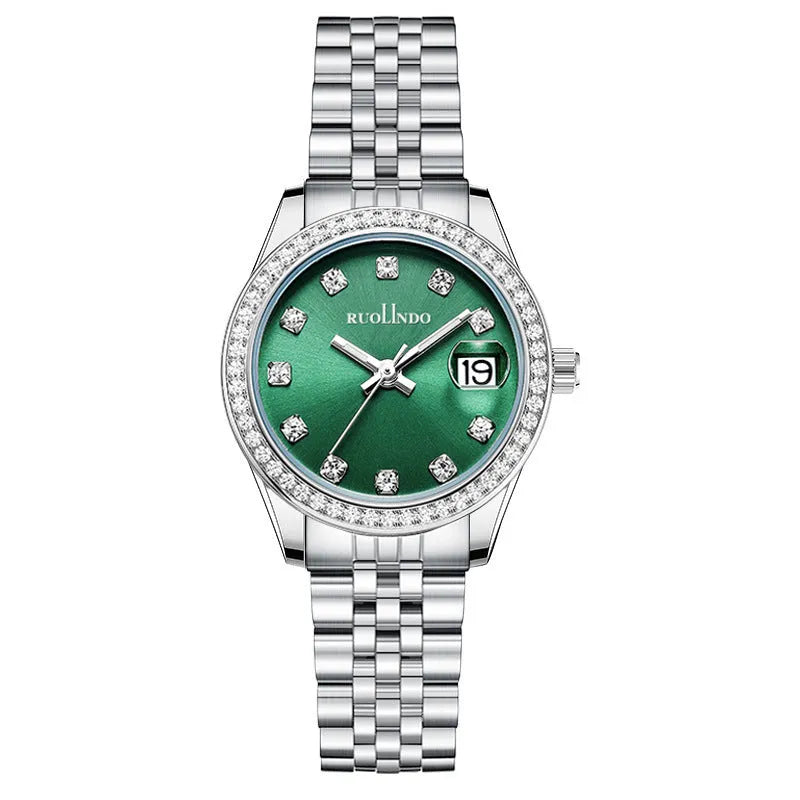 Women's silver alloy fashion watch with circular dial and stainless steel buckle on wrist.