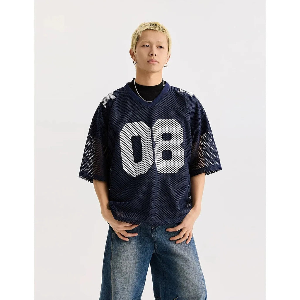 Black loose fit pullover shirt with a white letter pattern across the chest, modelled on a mannequin.