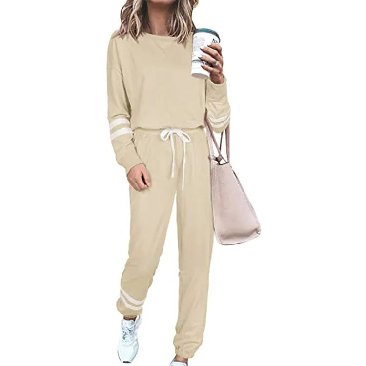 Women's plus size casual suit set in loose-fitting design with half-sleeve top and solid colour trousers