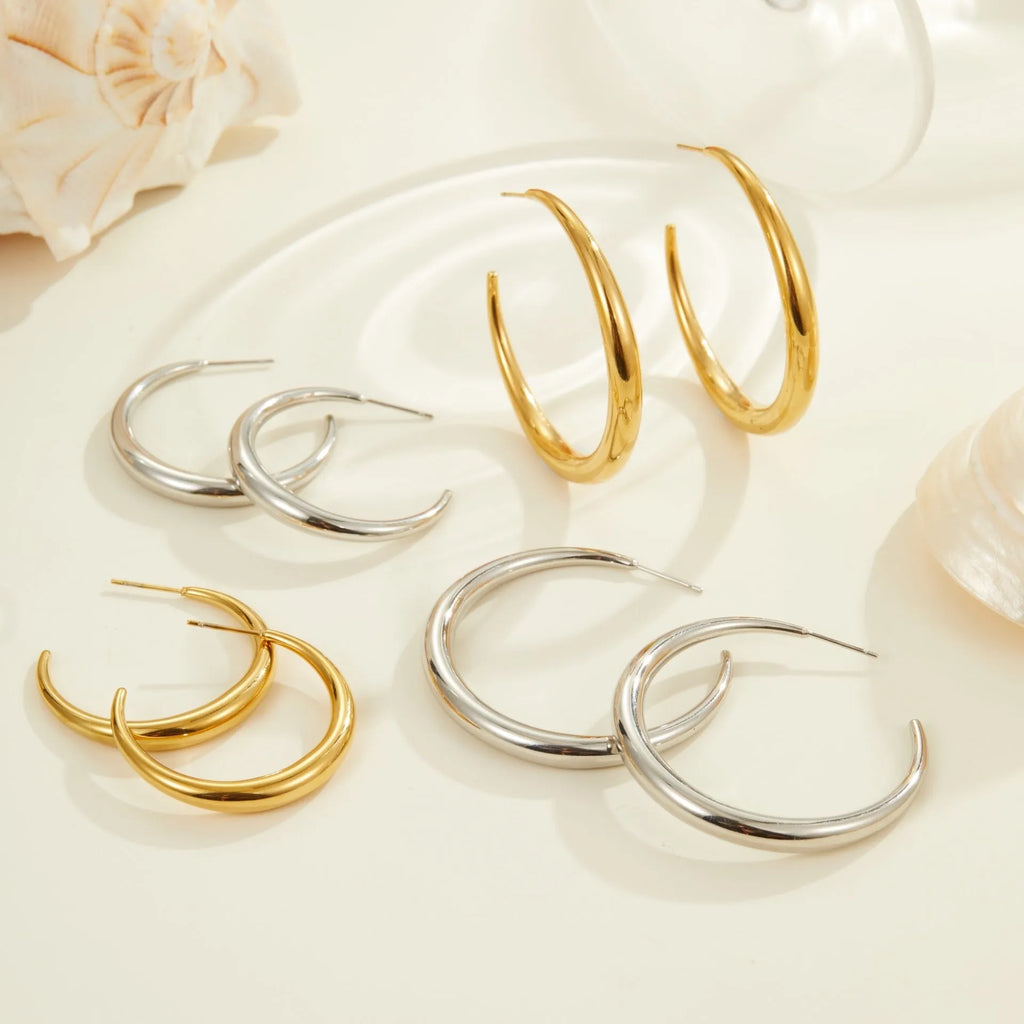 Titanium steel hoop earrings with geometric round shape in gold and steel colour options