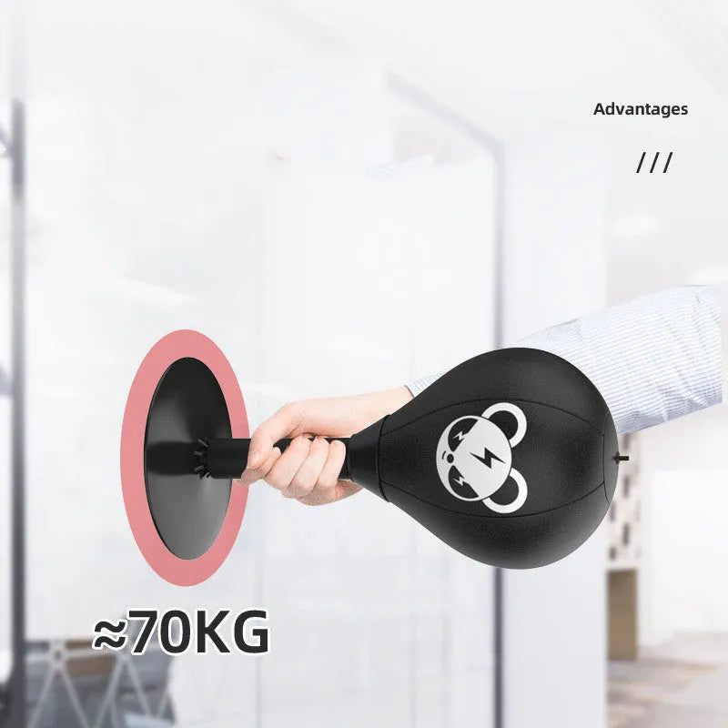 Tabletop boxing speed ball with suction cup base and inflatable PU leather sphere on a desk.