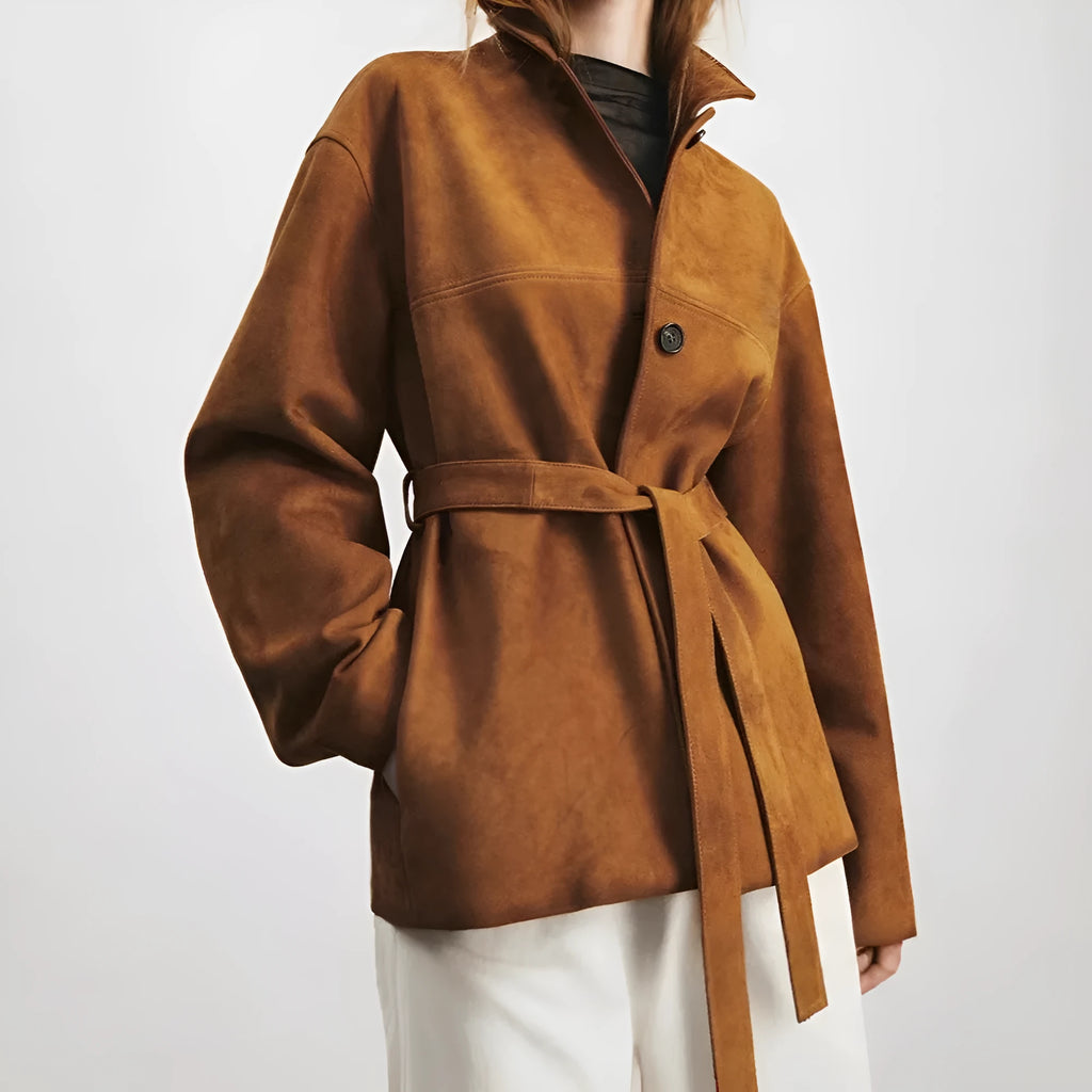 Women's mid-length caramel mocha cashmere coat with Peter Pan collar and leather stitching detail.