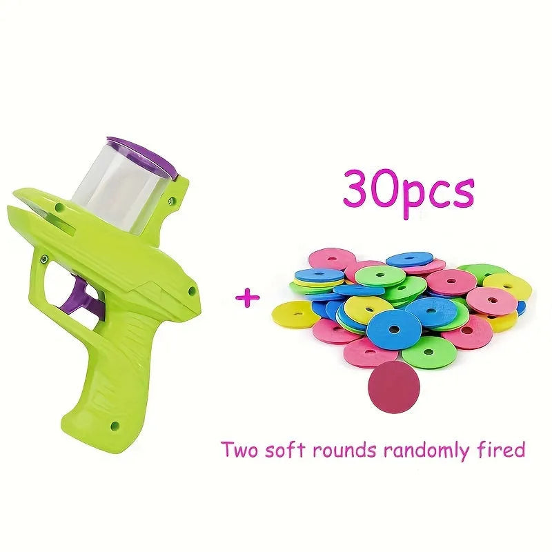 Interactive cat toy launcher firing foam disc with green plastic construction