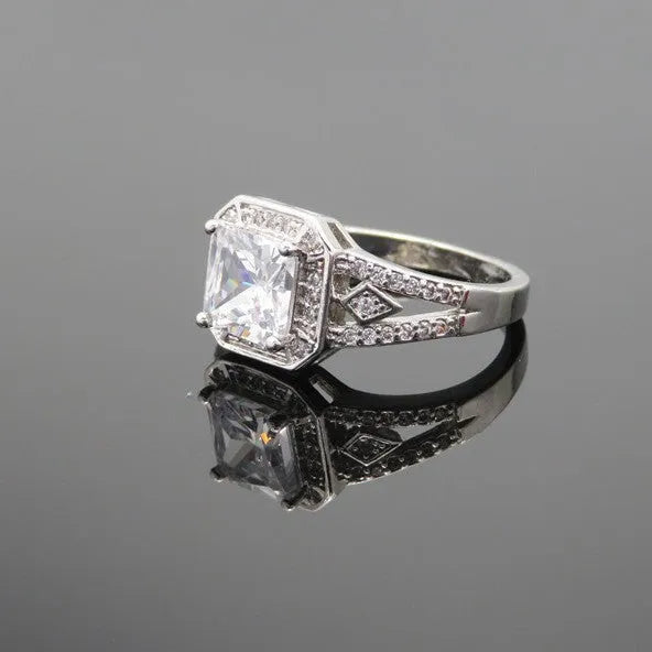 Geometric platinum colour zircon ring with quadrilateral design and hollow ornament construction