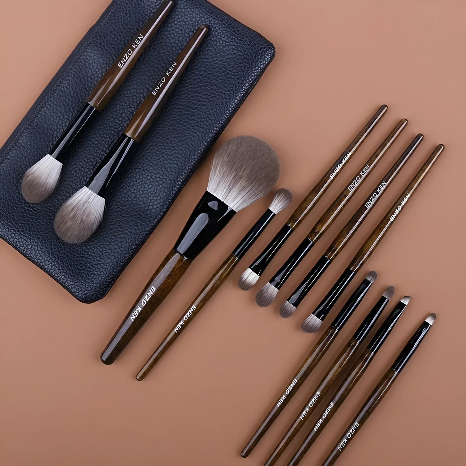 12 piece makeup brush set with wooden handles in a grey PU storage bag