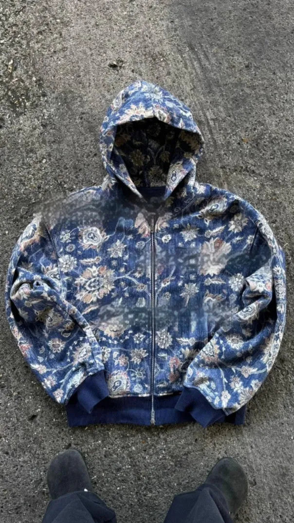 Men's blue hooded loose zip coat with digital printing shown with long sleeves and casual styling