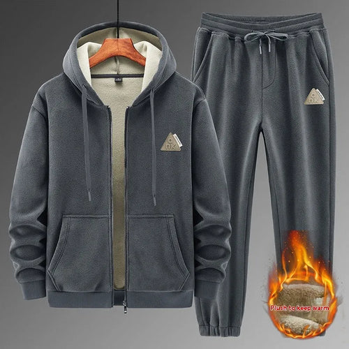 Casual grey sports suit set with a hooded cashmere-feel sweater and matching cotton-look pants on a hanger.