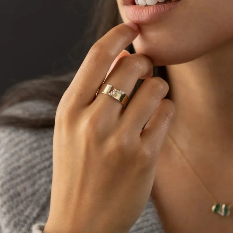 Gold electroplated women's fashion ring with shining zircon decorative element