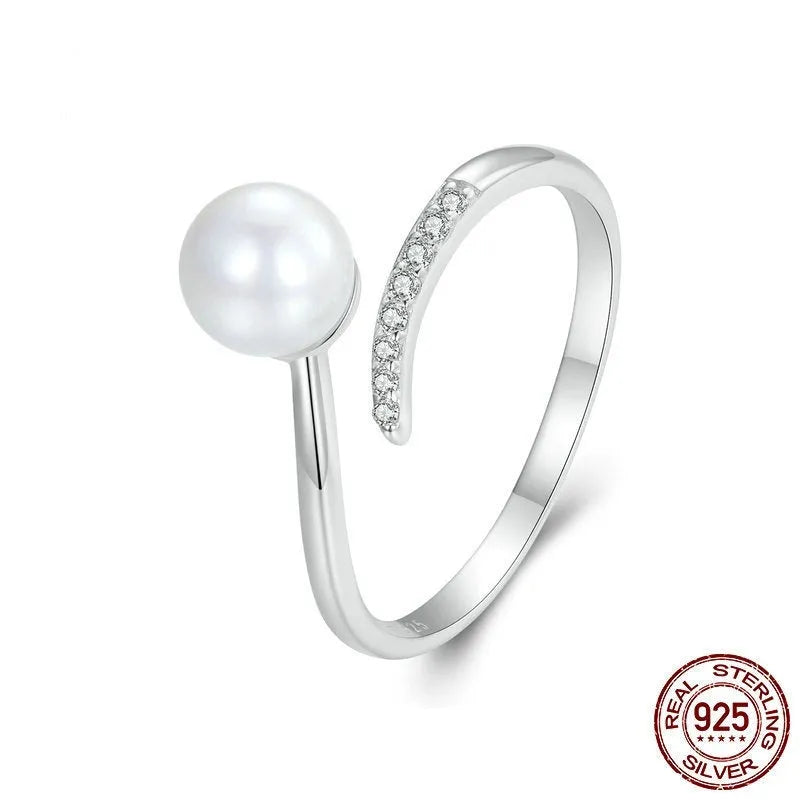 Sterling silver adjustable ring with freshwater pearl on open-loop design