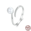 Sterling silver adjustable ring with freshwater pearl on open-loop design