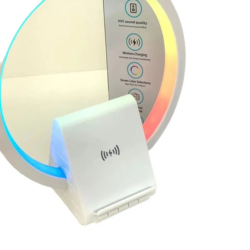White square Bluetooth speaker with integrated wireless charging pad and ambient LED lighting.