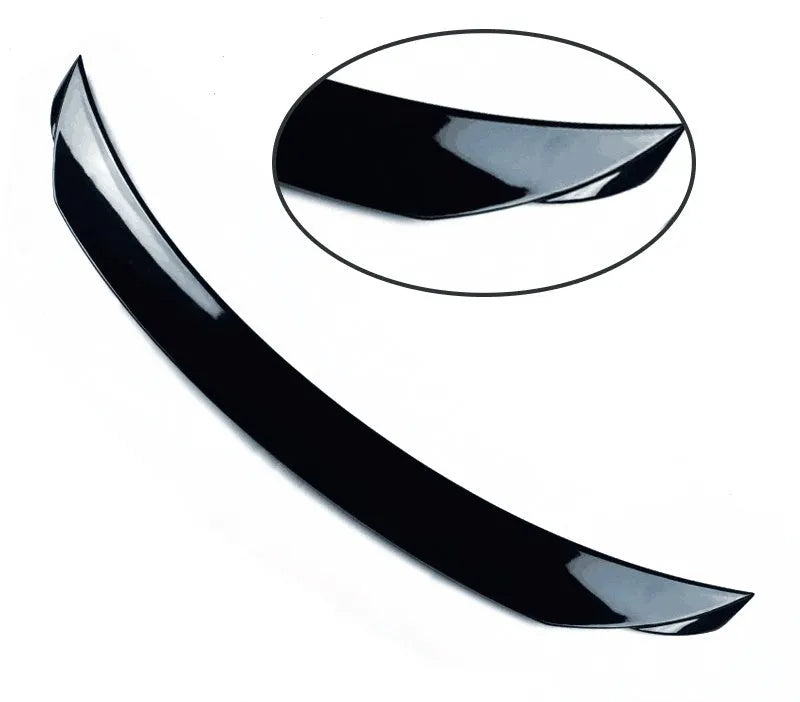 Mazda 3 Axela Exela rear diffuser spoiler tail trim in bright black installed on car bumper.