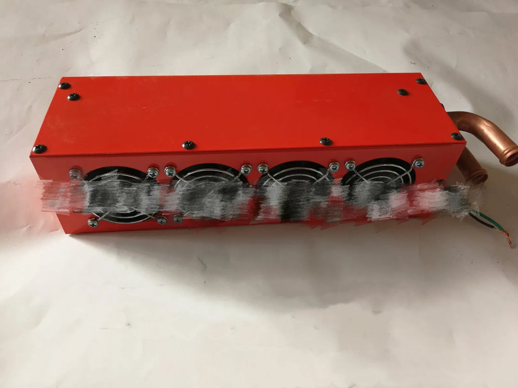 Metal car heater unit with copper pipe connections for 12V and 24V vehicle installation.