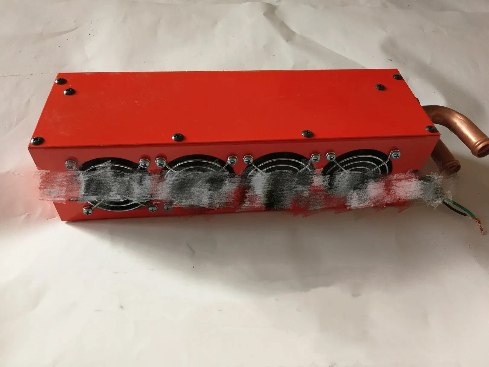 Metal car heater unit with copper pipe connections for 12V and 24V vehicle installation.