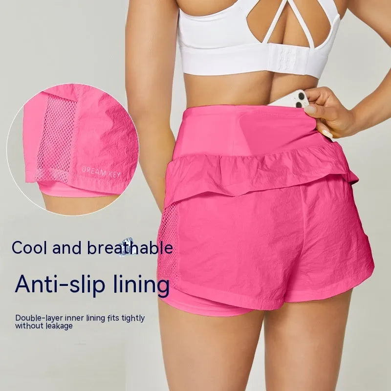 Women's loose casual quick-drying sports shorts in cotton blend fabric on a hanger.