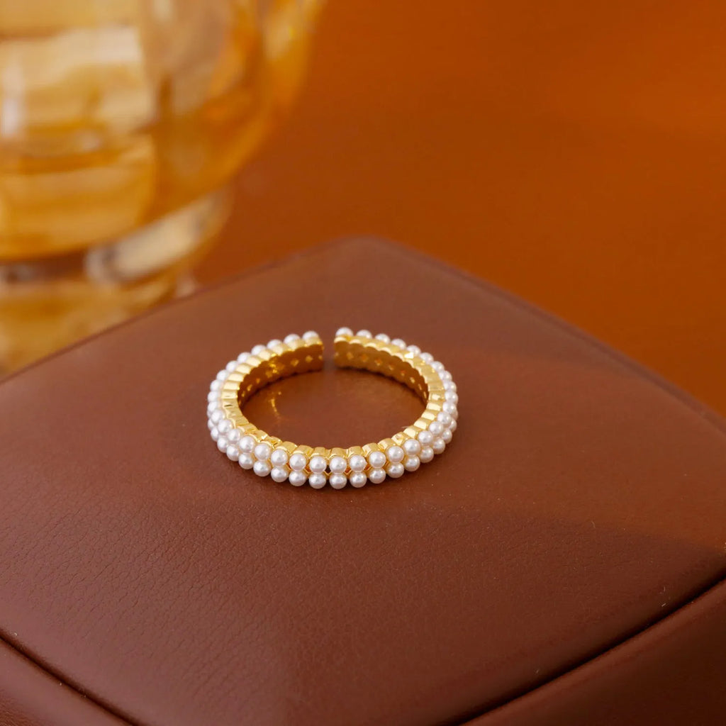 Gold electroplated open-mouth pearl women's ring with geometric design and round decorative elements