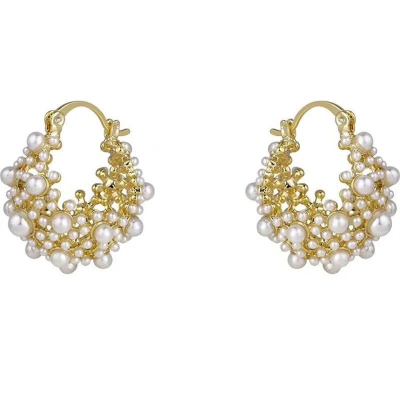 Gold-coloured copper flower basket earrings with rice-shaped bead decoration and pearl inlay detailing