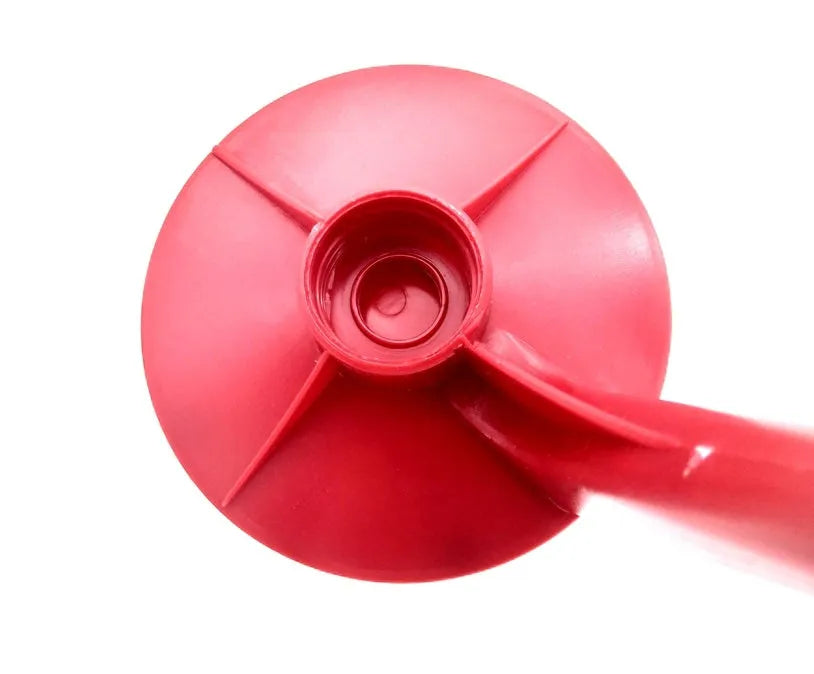 Red plastic Magic Tap soda dispenser attached to 2-litre bottle