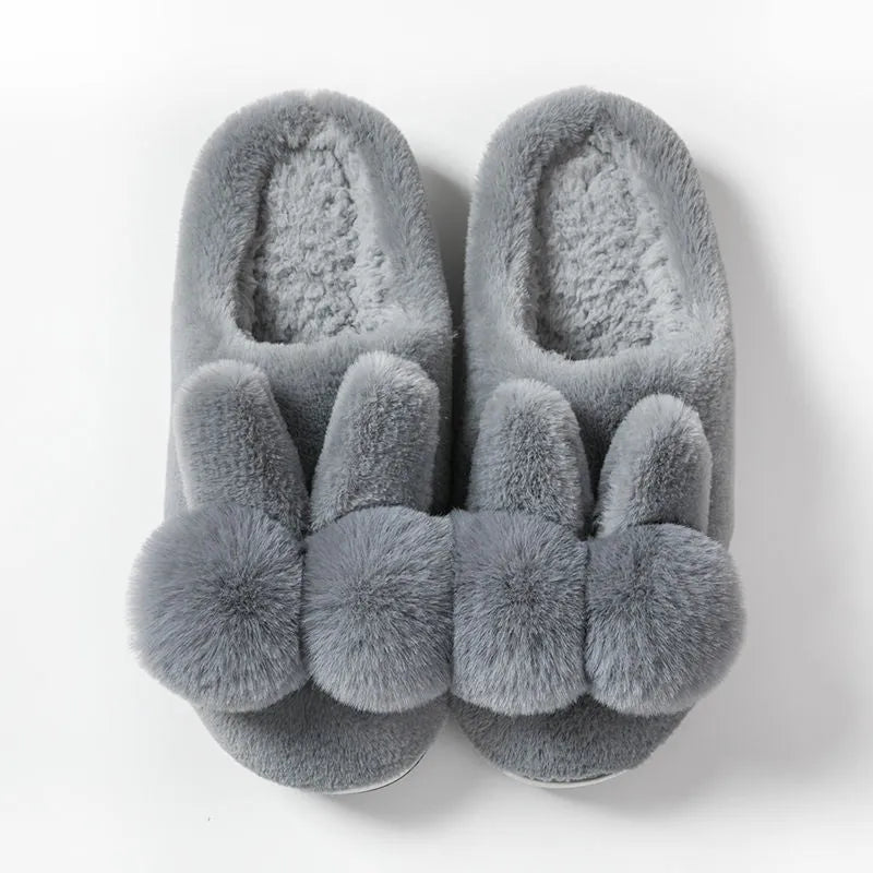 Women's fluffy rabbit fur slippers in pink with a high upper and sewn sole