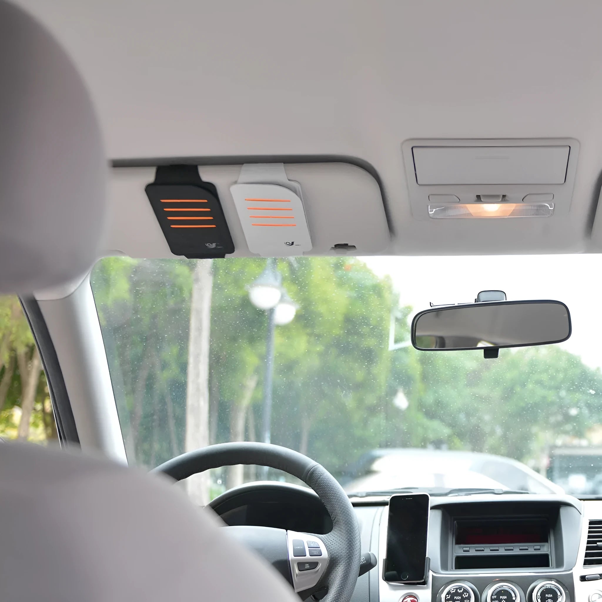 Set of four car sun visor shading panels and a vehicle storage bag.