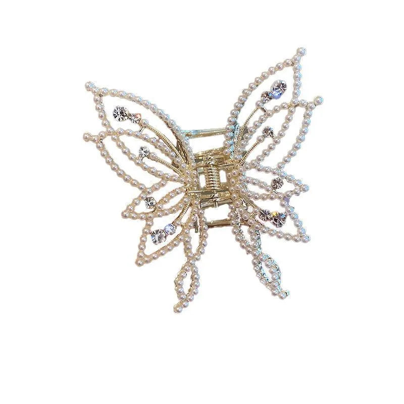 Elegant butterfly-shaped alloy hair clip for women, shown in rhinestone and pearl style options.