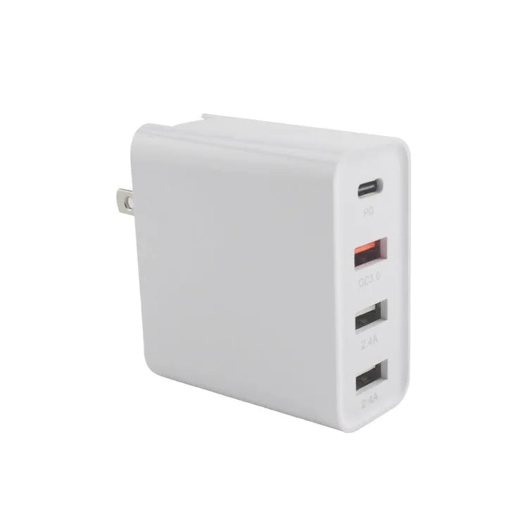 Black four-port USB-C wall charger with UK plug adapter and international travel plugs