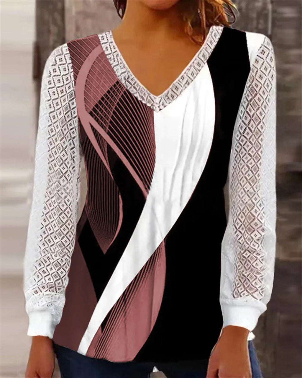 Purple loose V-neck women's top with a white hollow-out lace print pattern and long sleeves.
