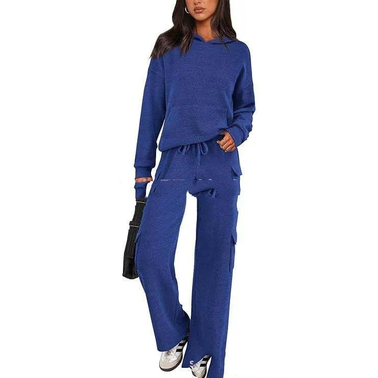 Women's two-piece polyester leisure suit in a solid colour, showing long sleeves and full-length trousers.