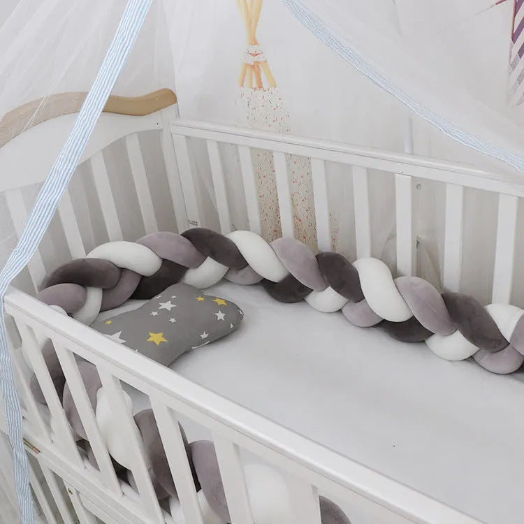 Soft spandex velvet baby crib bumper protector shown in a light grey colour, shaped around white crib bars.