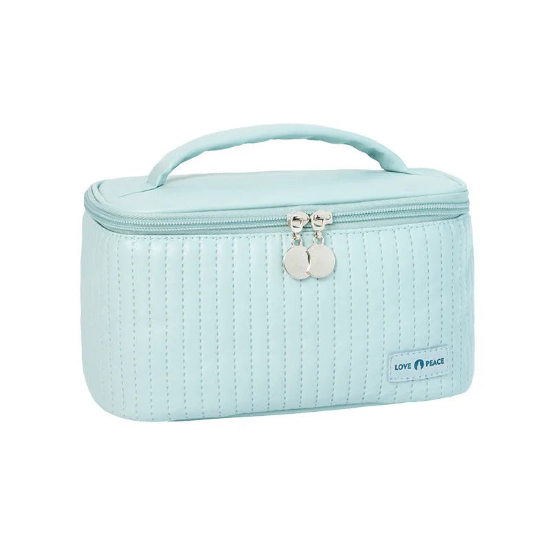 Open-top makeup bag in PU leather showing six colour options including pink, coffee, and light blue