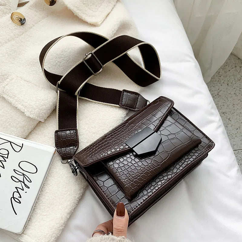 Vintage style crossbody bag in PU leather, shown in black, dimensions 20cm by 14cm.