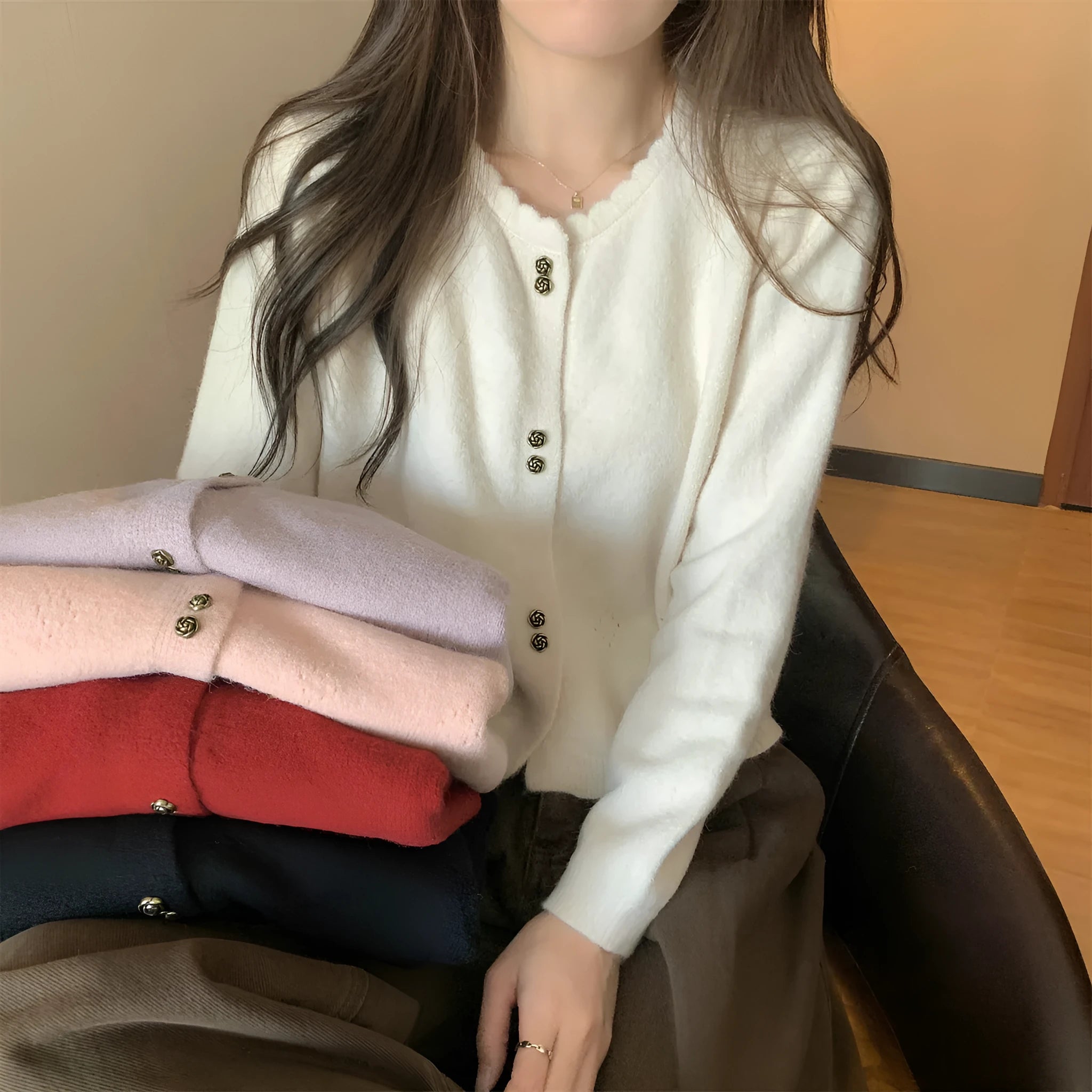 Women's long-sleeved acrylic cardigan sweater in five colour options with regular sleeve design