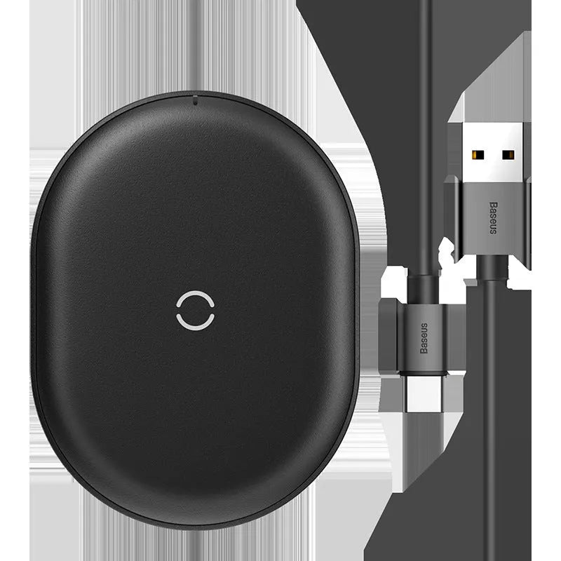Baseus rough-textured 15W wireless charging pad for mobile phones in black on a desk.