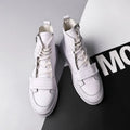 Black and white PU leather men's winter ankle boots in high-top sneaker style with size chart showing measurements from 24.0cm to 26.5cm
