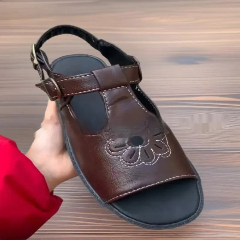 Men's black embroidered floral beach sandals with flat heel, showing PU upper material