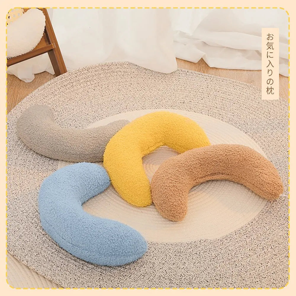 Blue U-shaped cat pillow with adjustable fabric collar for feline sleeping comfort