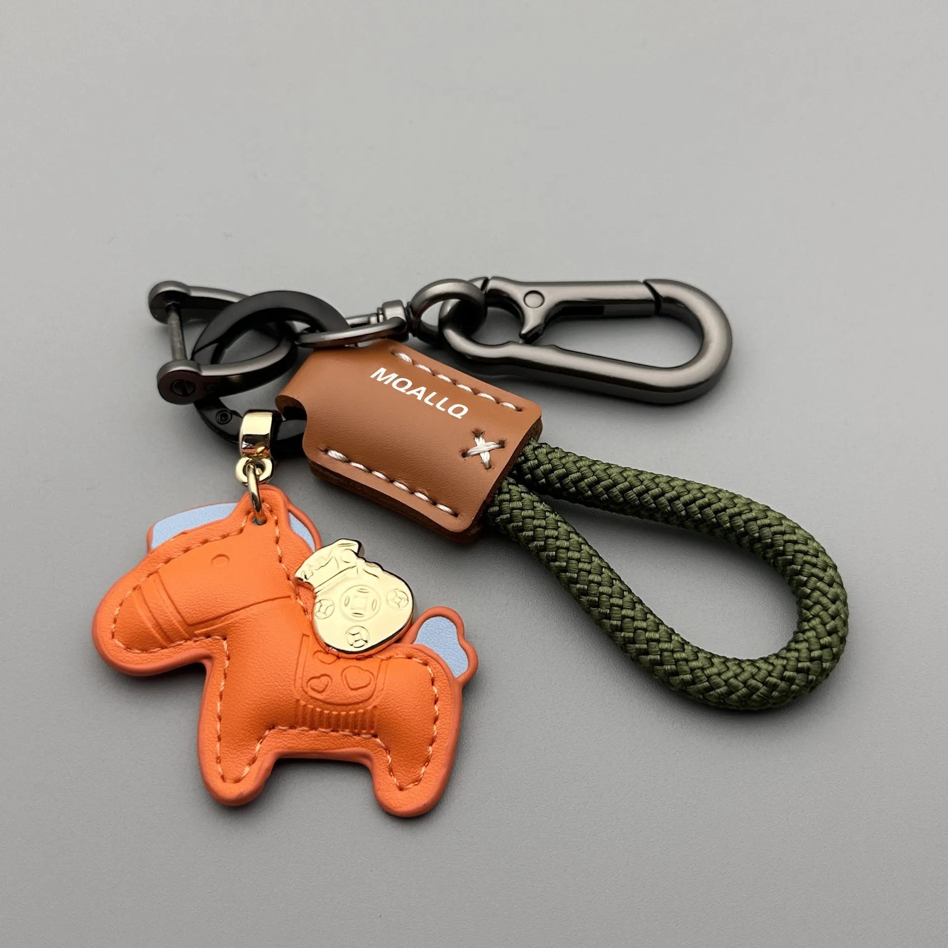Handmade brown cowhide leather car key ring pendant with a zinc alloy belt buckle and green flanelle rope.