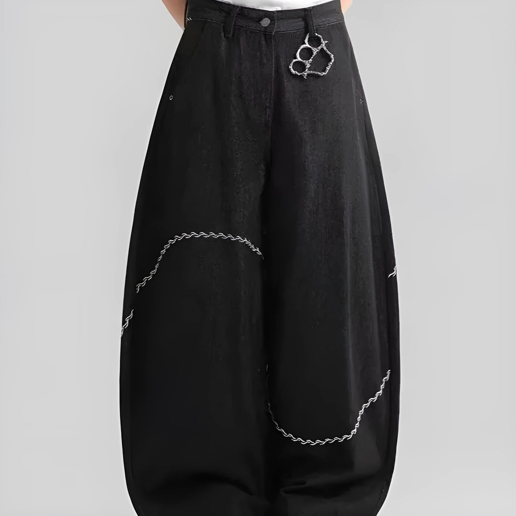 Black straight-leg denim trousers on a hanger, showing mid waist and zip placket detail.