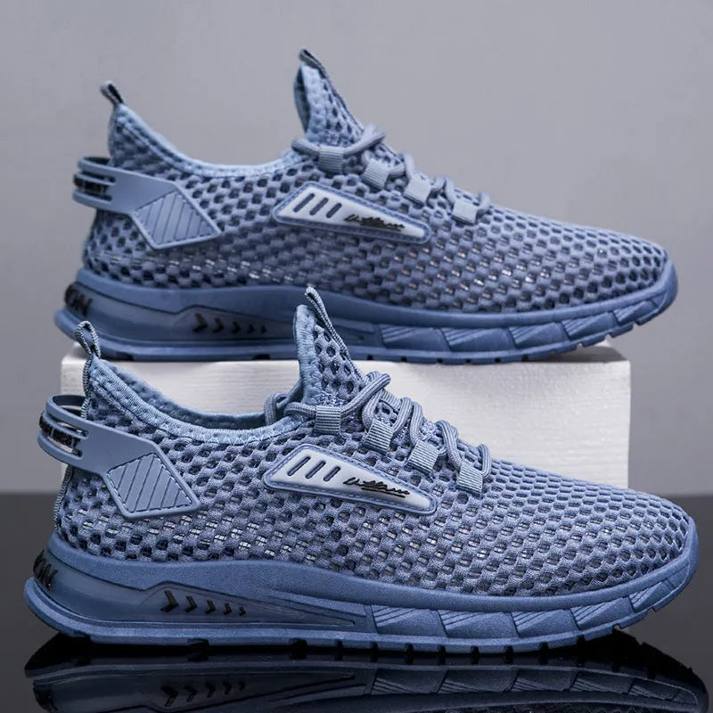 Men's beige lace-up sneakers with synthetic leather upper and mesh panels on a white background.