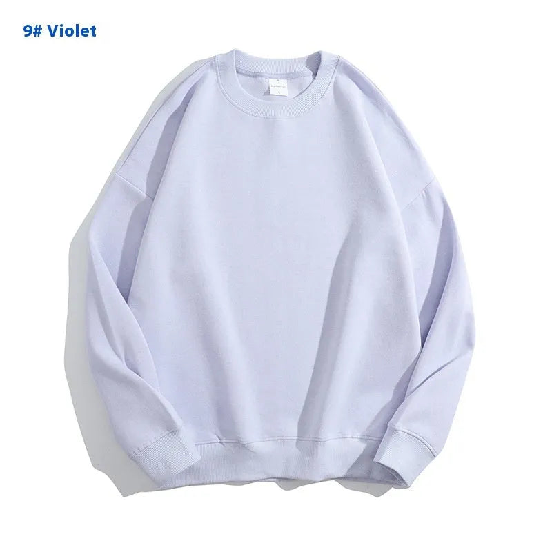 Women's loose fit cotton off shoulder sweater in a solid colour on a hanger.
