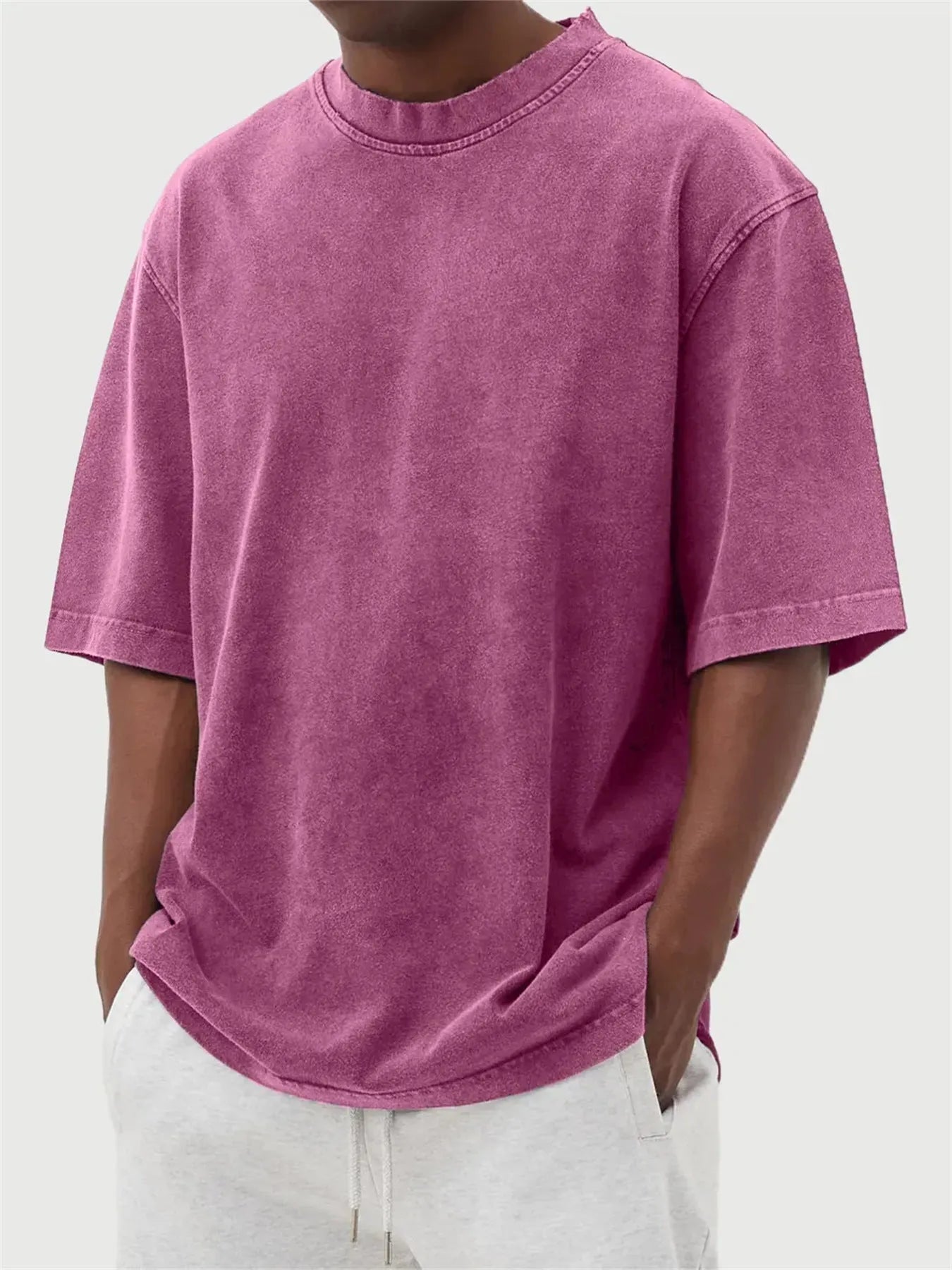 Men's loose-fit stone-washed t-shirt in army green showing distressed texture and pullover style.