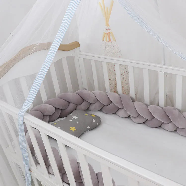Soft spandex velvet baby crib bumper protector shown in a light grey colour, shaped around white crib bars.